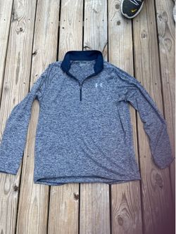 Clean minimalist athleisure essential from Under Armour featuring a modern heathered gray/navy marled pattern with lightweight HeatGear performance fa