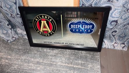 Atlanta United FC and Deep Eddy Vodka promotional bar mirror. This branded bar mirror highlights Deep Eddy Vodka as the "Official Vodka of Atlanta Uni