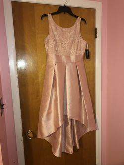 Ladies size 8 sleeveless dress with high low skirt and beautiful blush color.$80 or best offer .negotiable.jessica Howard brand