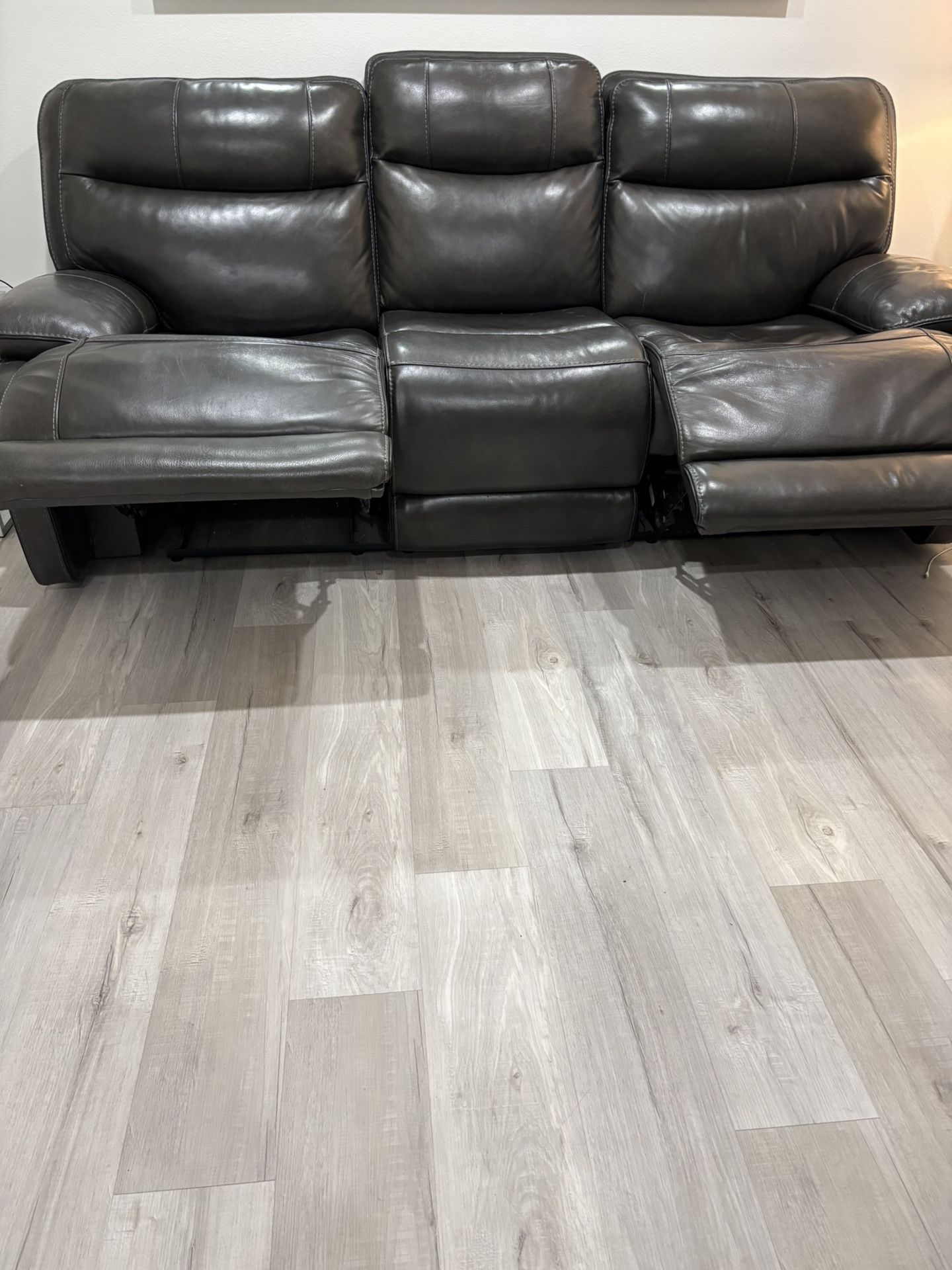 Dark grey 84in wide reclining couch