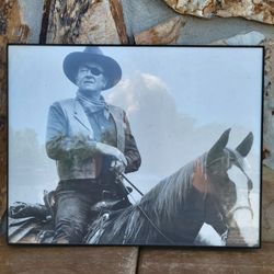 Famed vintage photograph of John Wayne as Rooster Cogburn from the 1969 film True Grit.