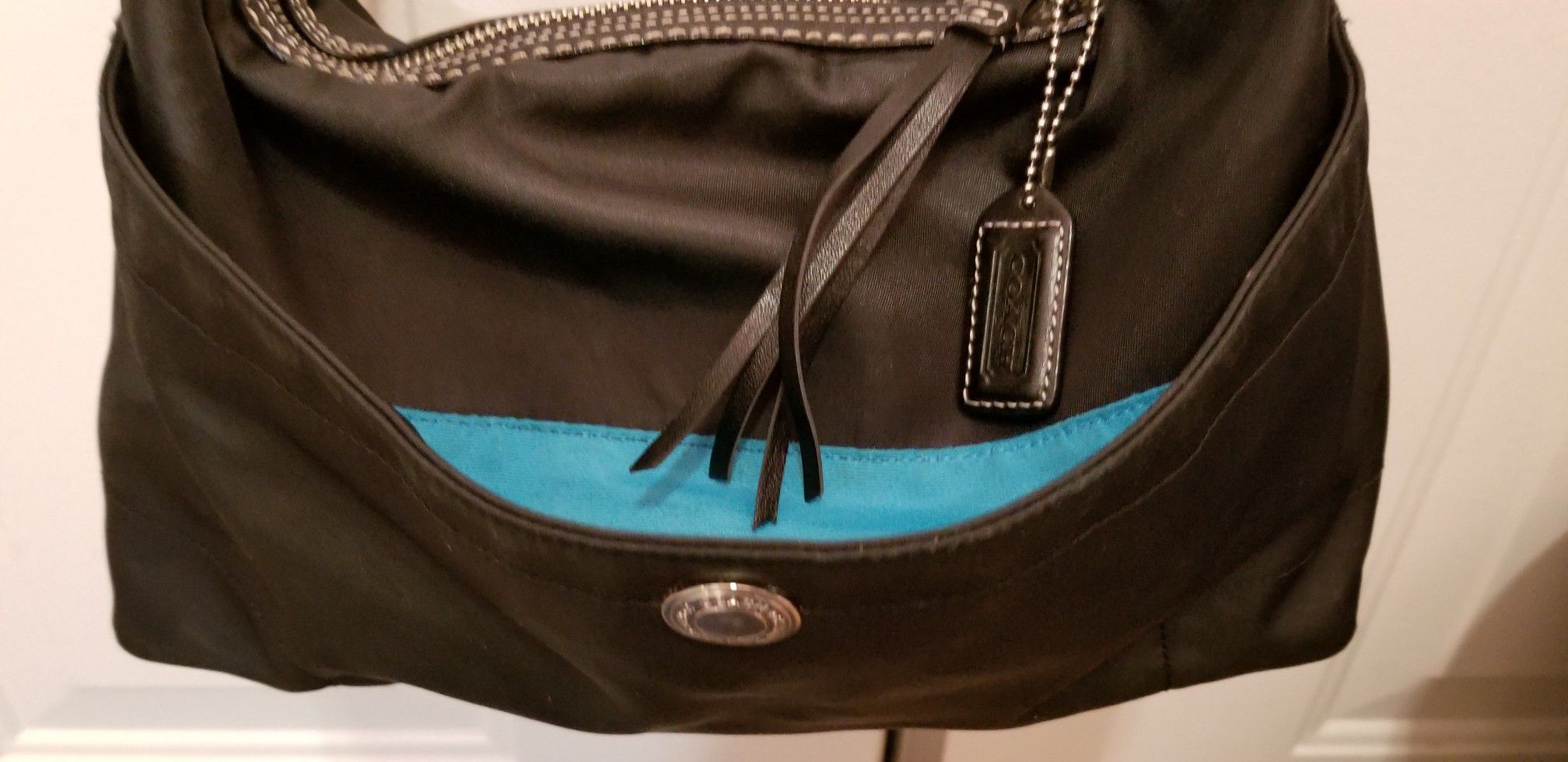 Coach black hobo shoulder bag. Black w Turquoise inside. Used, good condition $15