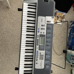 Casio LK-100 61-Key Key Lightning keyboard with Stand 