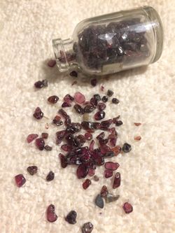 Small bottle of garnet stone