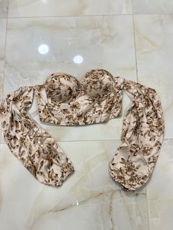 beige floral print EFJONE off-shoulder corset top with long lantern sleeves.