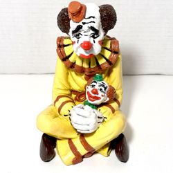 Vintage Sad Clown Holding Clown Doll Head Ceramic Figurine
