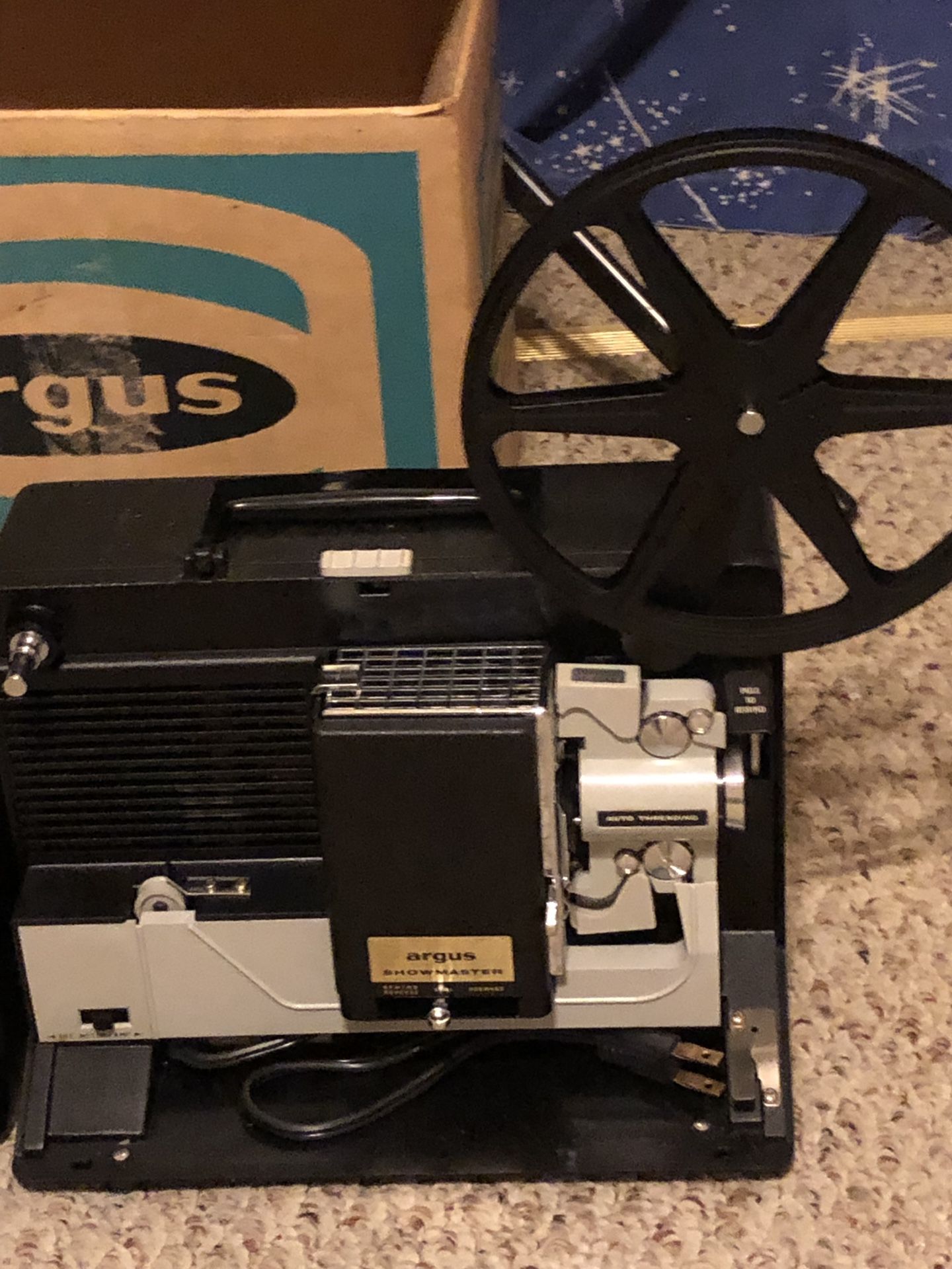 8 mm Argus Showmaster movie projector and screen.