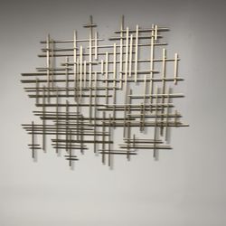 Modern gold metal wall décor. Previously used in a spa room.