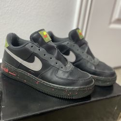  Nike Air Force 1 Low (black base with paint-splatter midsole and green/red tongue tag