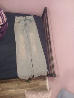 Light Wash Wide Leg Jeans with bows at the back pockets.
