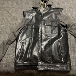 Size Large. Black leather motorcycle vest with concealed gun pockets