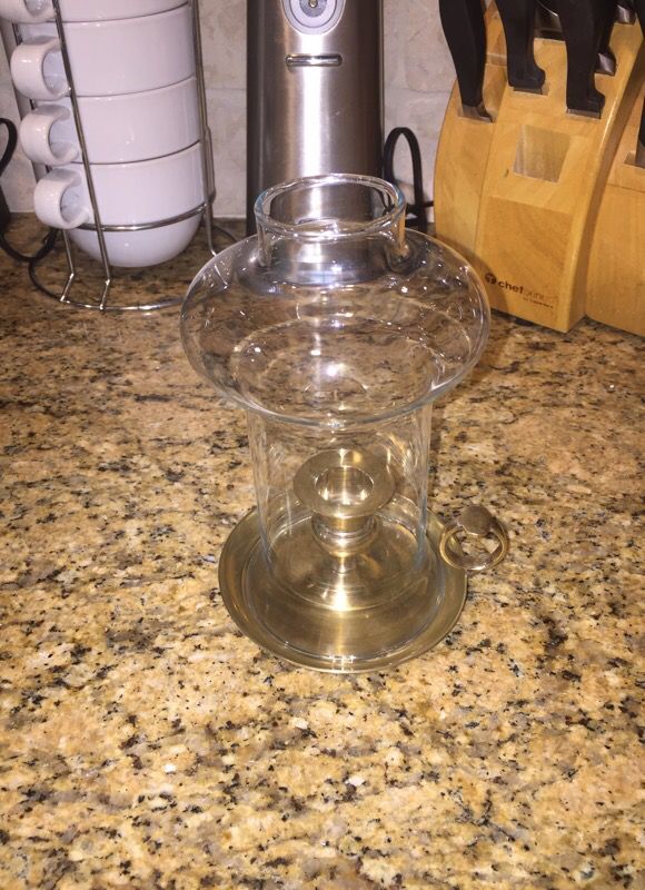 Hand held candle holder with glass