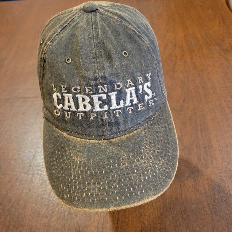 Cabela's legendary outfitter camouflage camo adjustable strap one size 
hat. Pre-owned,  good shape, please see photos for details. One size 
fits all