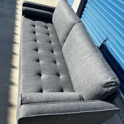 Brand New. Modern Sofa. Charcoal Grey. $299. Only 1 Available  
