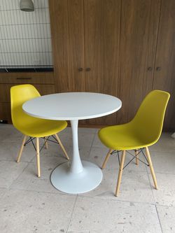 White Tulip/Pedestal Table with Two Yellow MCM Chairs