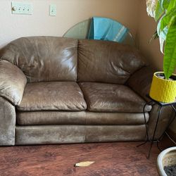 Rugged leather loveseat sofa