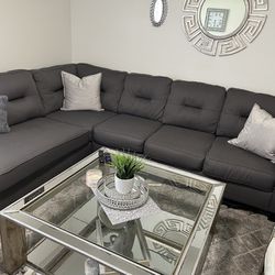 Glass Coffee Table And Dark Gray Sectional 