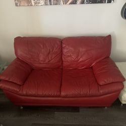 Real red leather love seat and matching white leather ottoman 