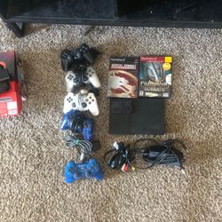 Selling my ps2 slim with 2 games, and 3 controllers and 2 memory cards