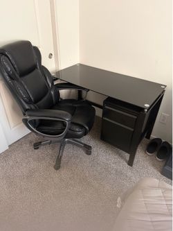 Like New Slightly Used Writing Desk featuring a tinted black glass top and leather executive chair