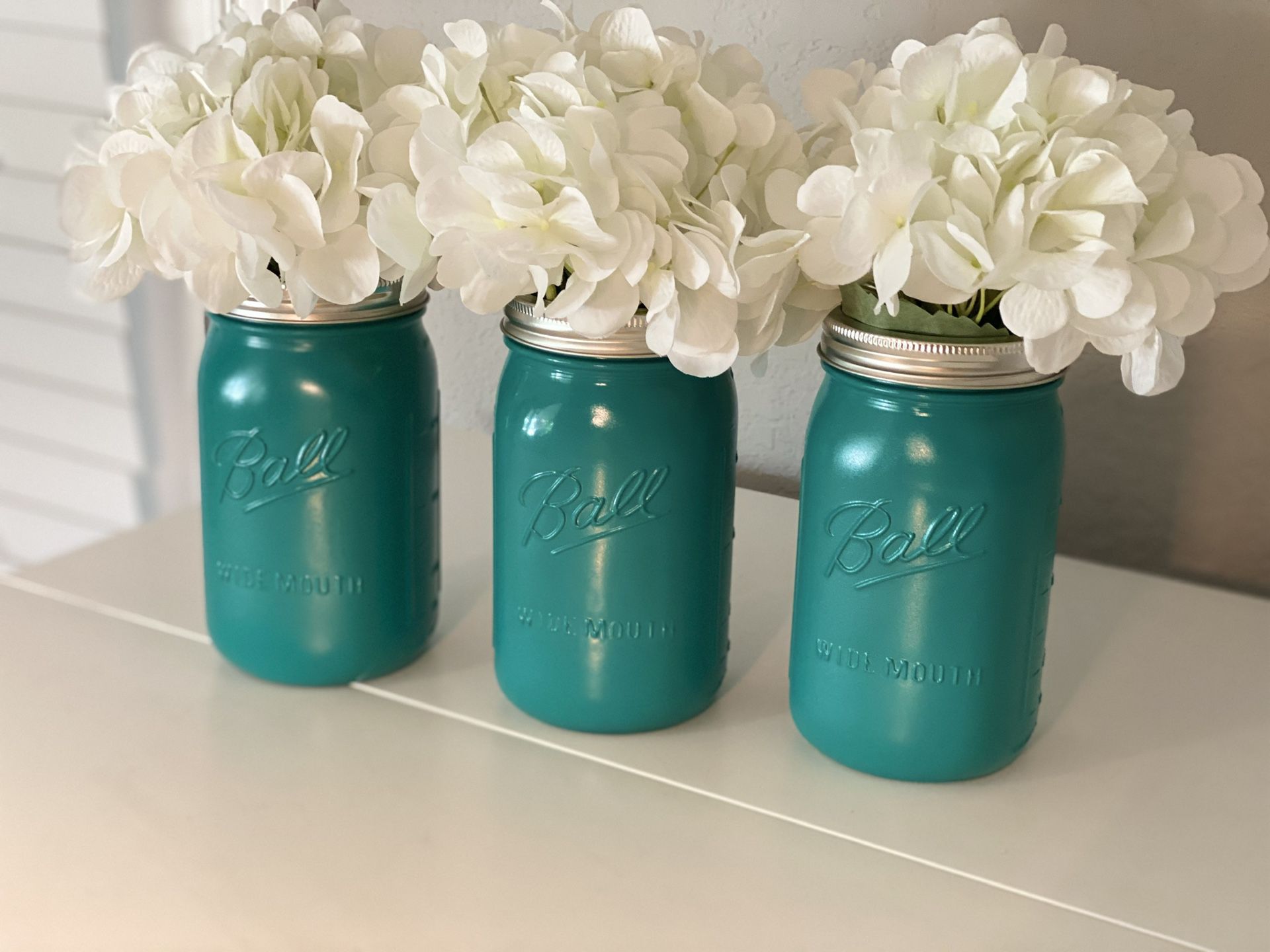 Set of three hand painted mason jars