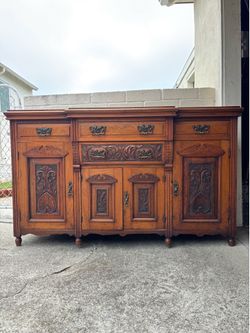 Antique Victorian Walnut Sideboard Featuring Intricate Hand Carvings and Original Ornate Brass Hardware