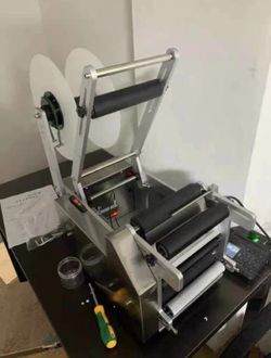 New semi-automatic labeling machine.
