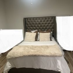 Coralayne Queen Vinyl Upholstered Bed with Faux Diamond Tufting