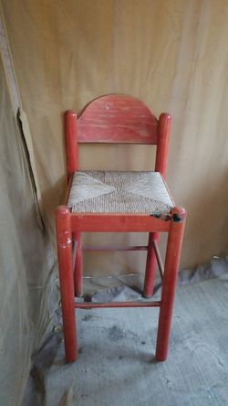 2 red wooden high chairs