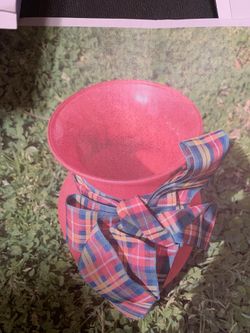 Red vase with ribbon