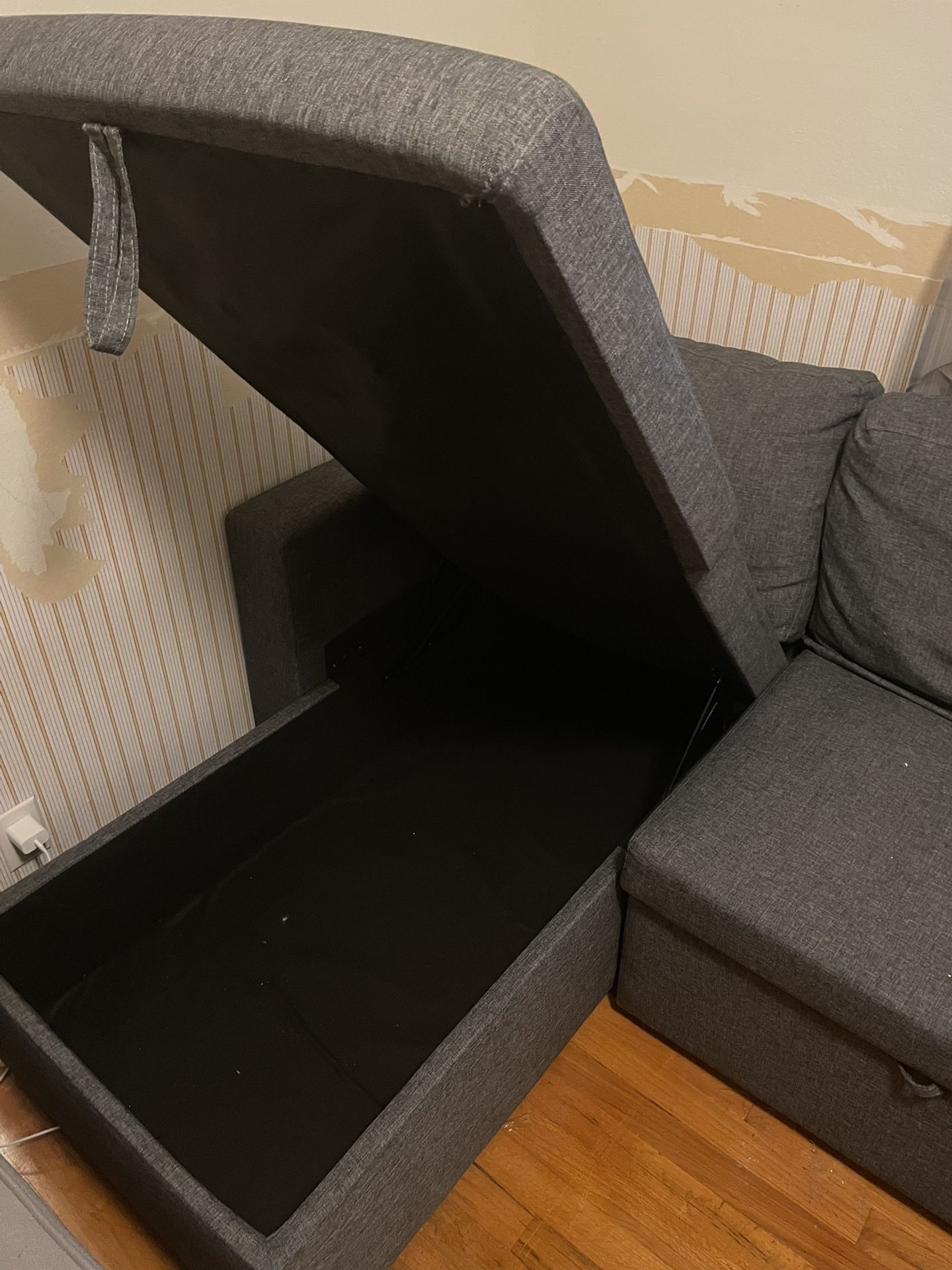 Grey convertible sleeper couch with chaise