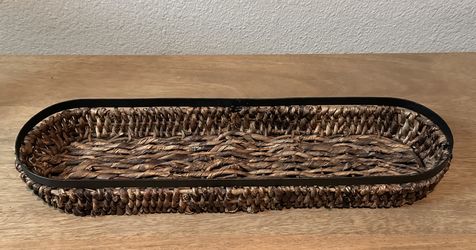 Long woven basket with metal frame