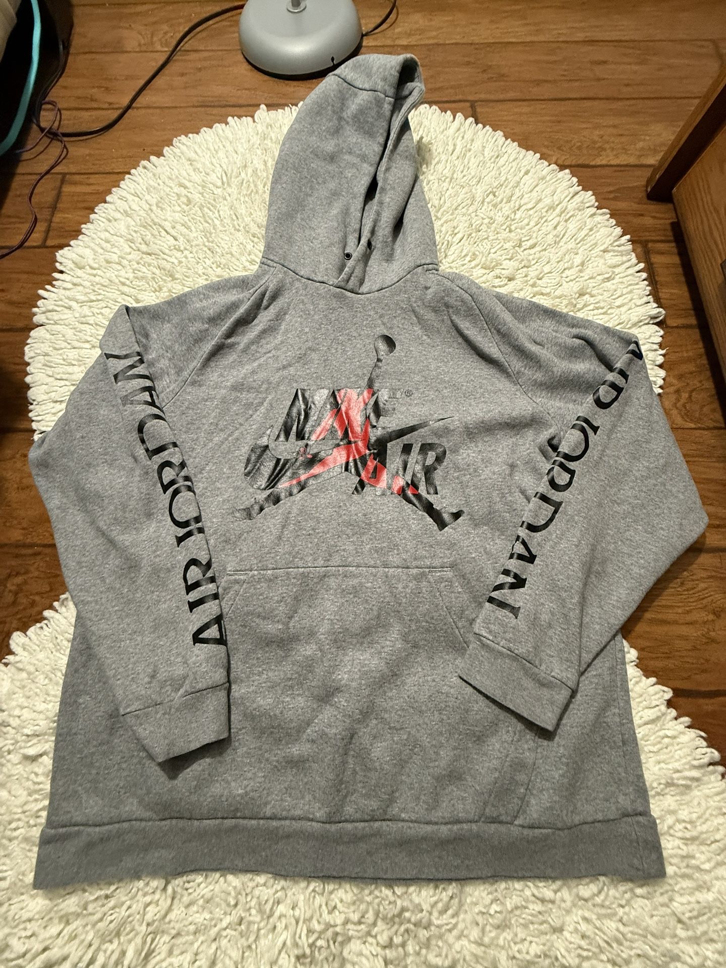 gray Air Jordan brand hoodie featuring the "Jumpman" logo graphic. XL on tag