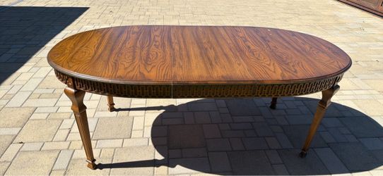 Oval Wood Dining Table with Carved Apron