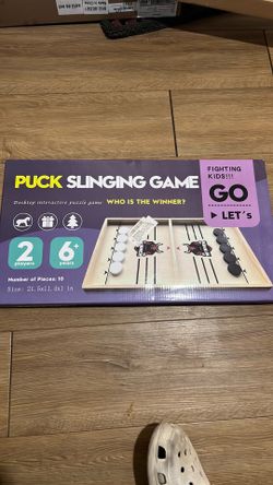 Puck slinging game