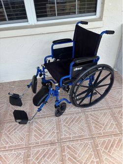 Wheelchair with adjustable foot rests wheel chair
