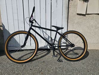 Fit Bike Co. CR 26 BMX Bike in black with tan sidewall tires.
