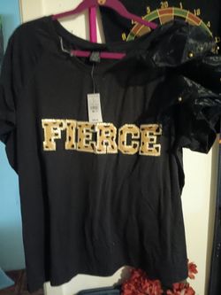 FIERCE" graphic across the chest and an attached shoulder ruffle detail.