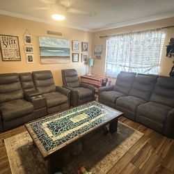 Power Reclining sofa , love seat with center console , and recliner .