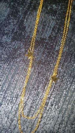 Gold tone layered shooting star necklace