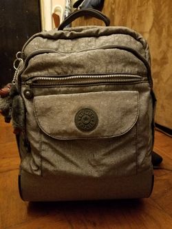 Brand new never used Kipling rollipng back pack 90$ or better offer