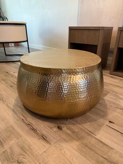Large hammered gold drum coffee table