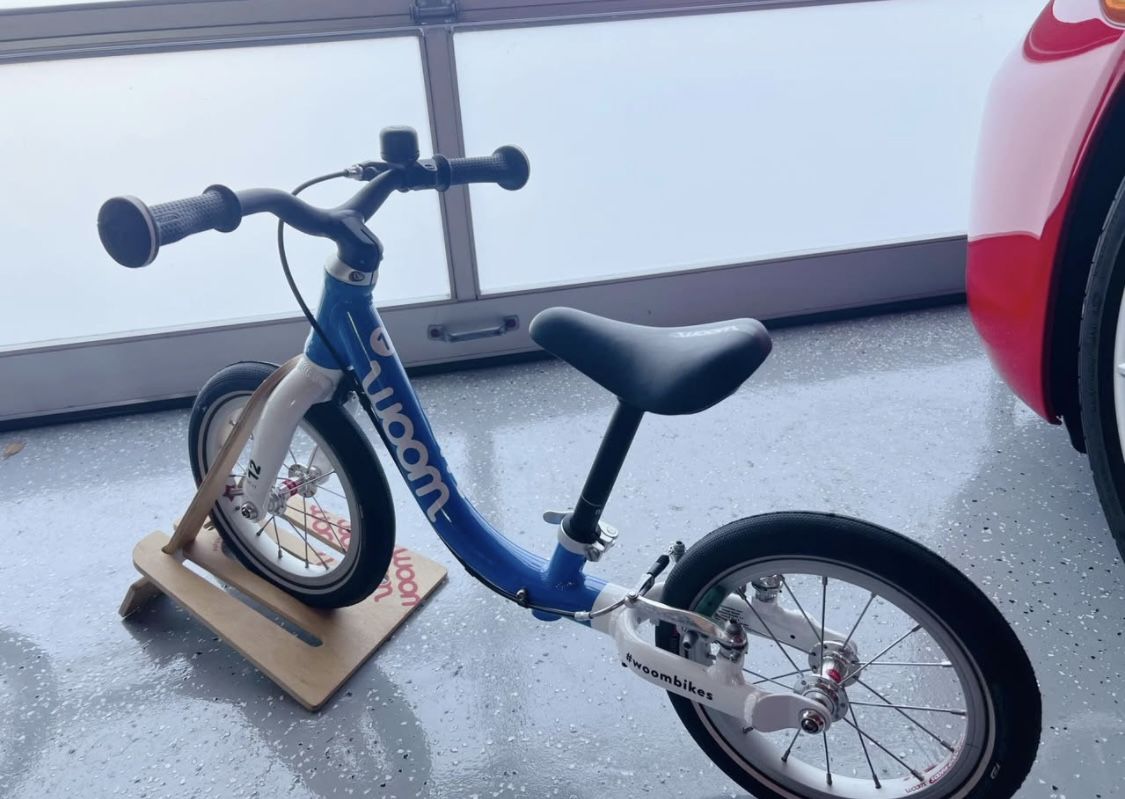 Woom 1 Balance Bike + Footrest And Stand