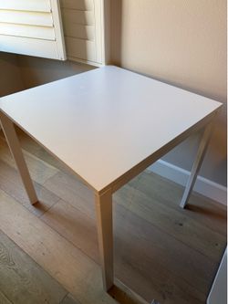 Desk/table- top is wood, legs are metal
