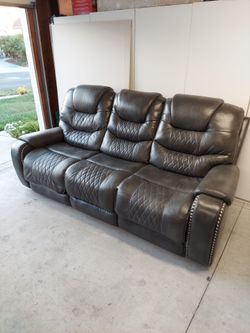 Power gray Leather Reclining Sofa priced for quick sale!