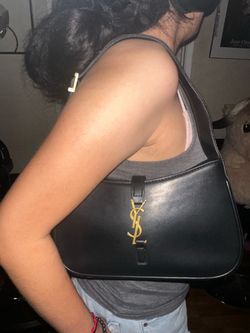 Black shoulder bag with dust bag