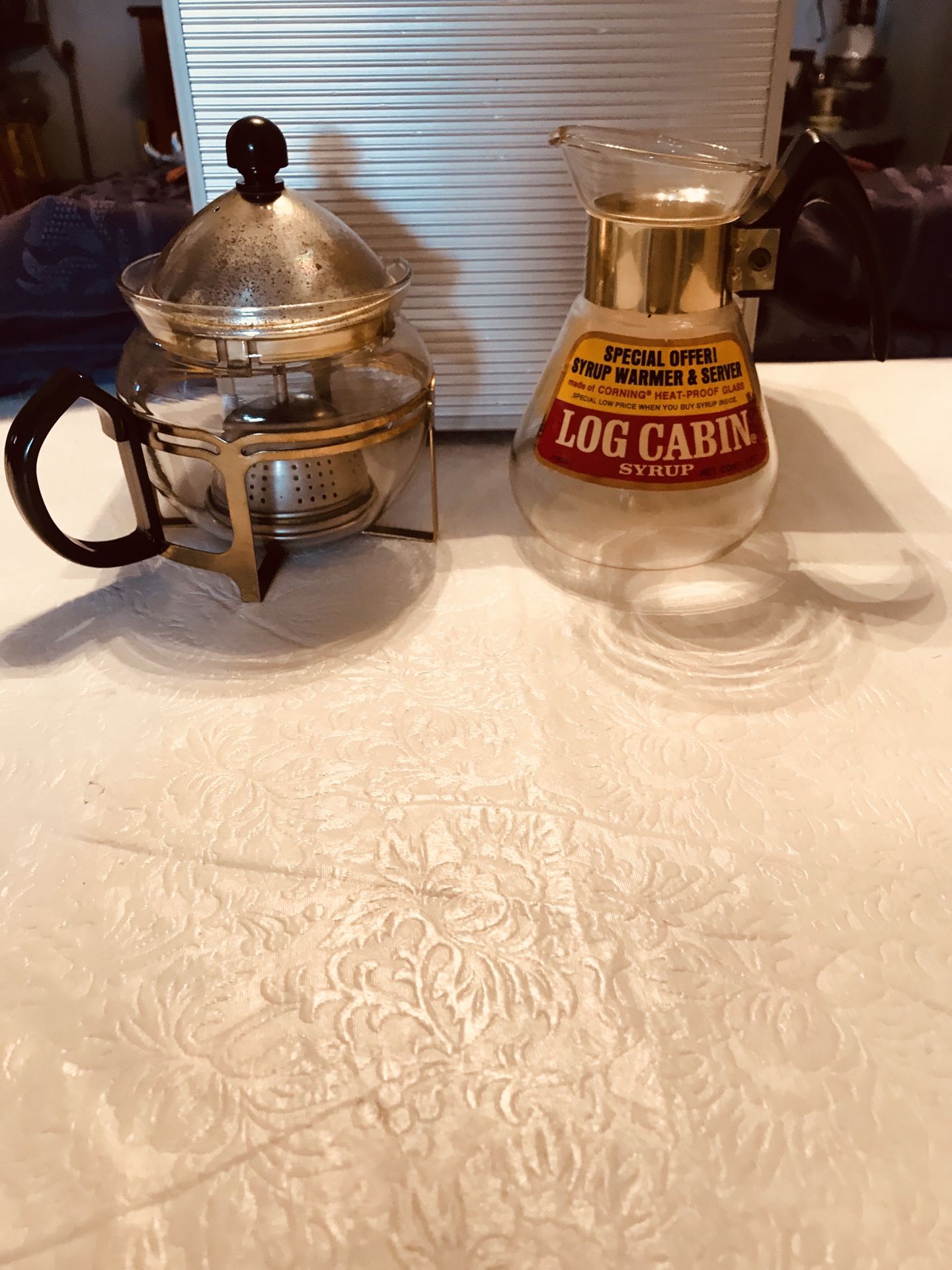 2 Vintage glassware items, ( small teapot with a tea ball and lid ( log cabin syrup warmer and server) Corning Heat proof glass