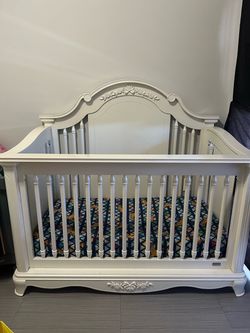 White Wood Baby Crib with Floral Detail