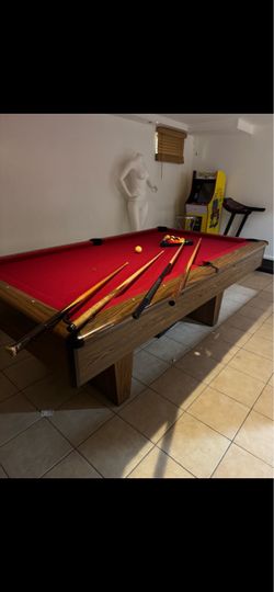 Selling my pool table with pool sticks
