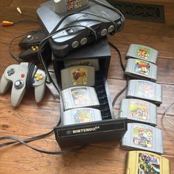 Nintendo 64 with  Super Smash Bros, Super Mario 64, Zelda Ocarina of Time, Zelda Windwaker and 2 Controllers